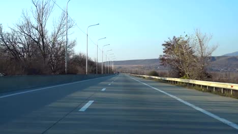 Driving-car-on-highway-in-Georgia.-Transportation.