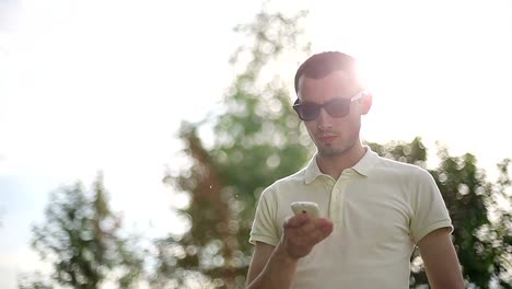 Man-outdoors-talking-on-the-phone.-Slow-motion