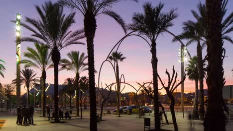 barcelona-sunset-palm-port-vell-view-metal-sculpure-4k-time-lapse-spain