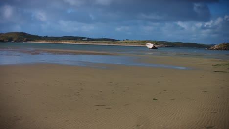 4k-Shot-of-Ship-Wreck-on-Irish-Coast-Beach