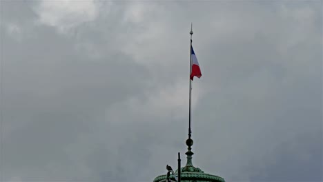 The-flag-on-the-side-of-the-Eiffel-tower