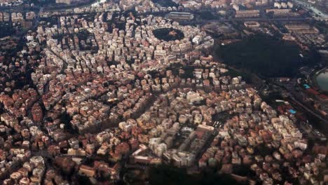 Aerial-view-of-the-beautiful-panorama-of-Rome,-Italy.-Filming-from-the-plane,-famous-capital-from-the-air