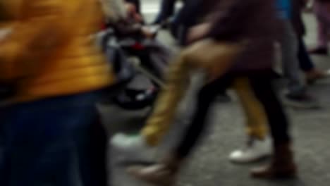 Detail-of-feet-passing-through-a-pedestrian-crossing.