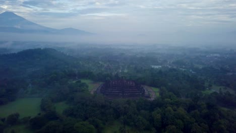 Aerial-view-drone-shot-of-Borobudur-temple-in-Java-at-sunrise,-Indonesia-Travel-religion-drone-concept-4K-resolution