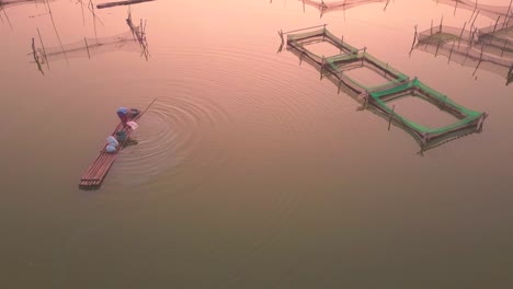 Fishermen-preparing-his-fishing-nets-at-sunrise-for-catching-fish-at-Rowo-Apung-Floating-Place-Jombor-Klaten,-Yogyakarta-Indonesia