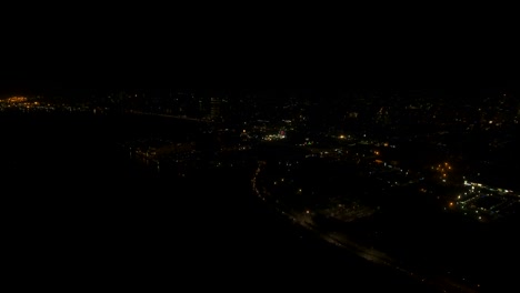 Aerial-city-with-skyscrapers-and-buildings-by-night.-Philippines,-Manila,-Makati