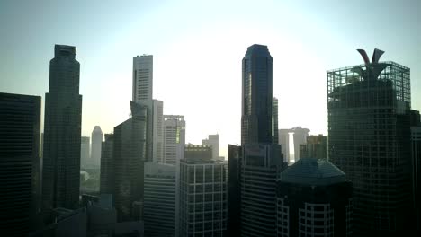 Schönen-guten-Morgen-Drohne-Aufnahmen-von-städtischen-Skyline-von-Singapur-im-zentralen-Geschäftsviertel-mit-Marina-Bucht-Hintergrund.