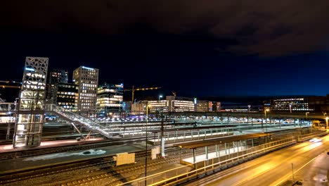 Noche-de-Oslo-skyline-ciudad-timelapse-en-el-distrito-de-negocios-de-Bercode-proyecto,-lapso-de-tiempo-Oslo-Noruega-4K