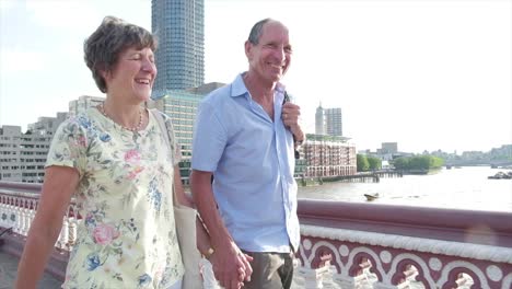 Active-senior-couple-walking-in-london