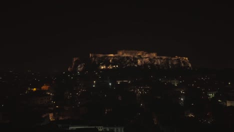 Aerial-view-of-the-parthenon-temple-on-acropolis-hill-at-night-in-Athens.