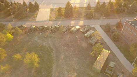 aerial-view-of-row-of-military-vehicles-machines-during-sunset