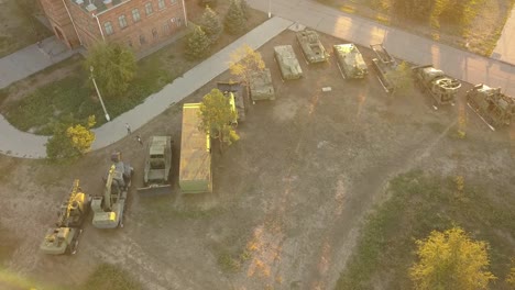 aerial-view-of-row-of-military-vehicles-machines-during-sunset