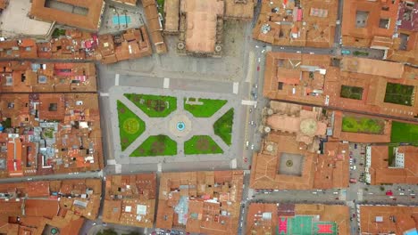 Aerial-view-of-Cuzco-city-red-rooftops,-Peru.