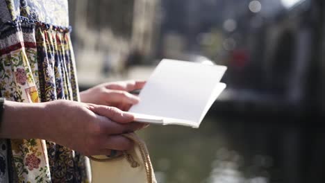 Woman-sitting-on-the-riverbanks.