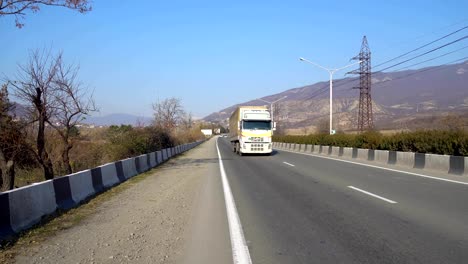 Driving-car-on-highway-in-Georgia.-Transportation.