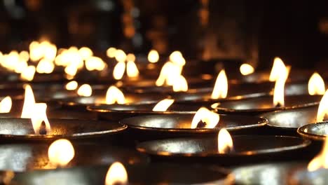 Candle-Offerings-in-Buddhist-Temple-in-Kathmandu,-Nepal