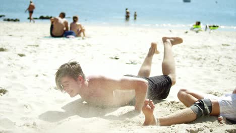 Friends-compete-to-score-a-header-on-a-beach.