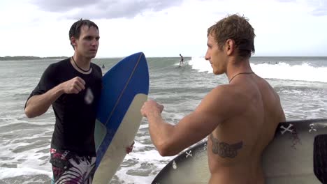 SLOW--MOTION:-Surfers-fist-bump