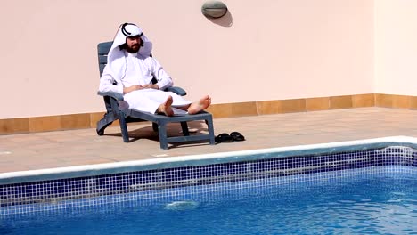 Saudi-arabian-man-enjoying-at-swimming-pool