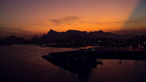 Flying-low-angle-aerial-view-of-Rio-de-Janeiro-at-Dusk,-Brazil