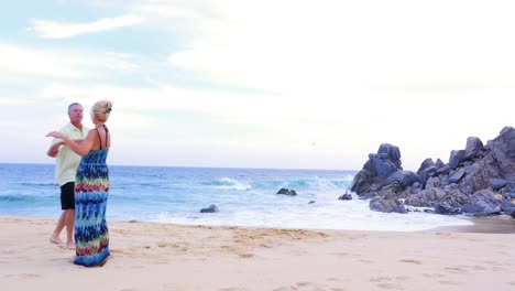 An-older-couple-dancing-on-the-beach