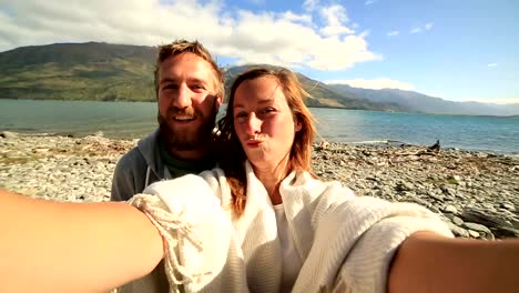 Self-portrait-of-a-young-couple-by-the-lake-shore