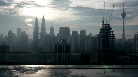 Timelapse-of-Kuala-Lumpur,-rooftop-pool-view