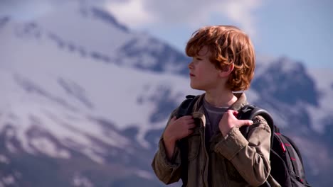 Boy-with-a-Backpack-in-the-Mountains