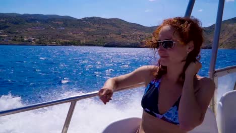 Young-attractive-woman-relaxing-on-a-sailing-yacht.-Girl-having-fun-on-a-yacht.