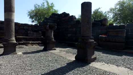 Walking-Among-Old-Black-Columns-in-Ruins