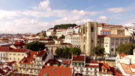 Aerial-view-of-historical-part-of-Lisbon-and-Lisbon-Cathedral-at-sunny-day-Portugal