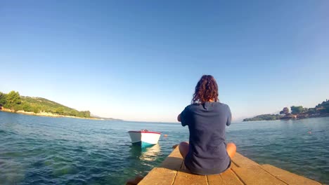 4K-beach-yoga,-caucasian-girl-on-a-dock,-wide-shoot,-quad-HD