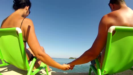 Happy-Romantic-Couple-in-bikini-Enjoying-Beautiful-hoeymoon-at-the-Beach