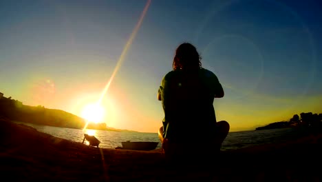 Meditation-near-the-sea-&-doing-yoga-on-a-beach-at-sunrise