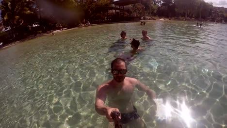 Man-taking-a-selfie-in-a-Pool-in-Queensland,-Australia