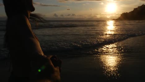 Girlfriend-holding-hands-Boyfriend-at-Sunset-Beach