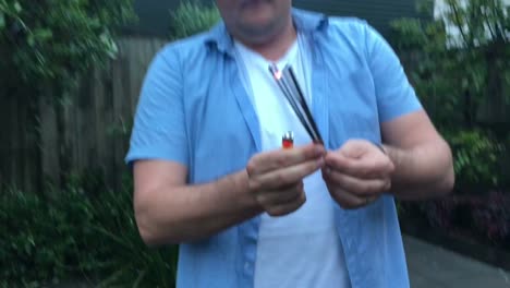 Adult-man-plays-with-fireworks-in-slow-motion