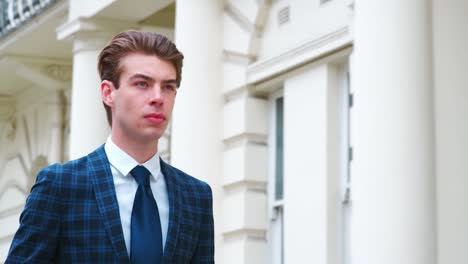 Stylish-Young-Man-Carrying-Coffee-Walking-On-City-Street