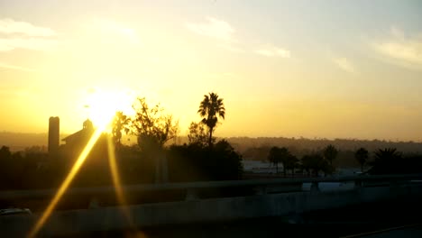 POV-driving-a-car-at-sunset-in-California-in-slow-motion