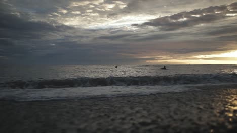 Surfers-swimming-in-sea