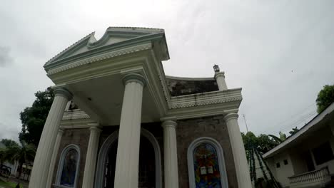 Adoration-chapel-of--Our-Lady-of-Pillar-of-Alaminos,-Laguna,-Philippines-showing-her-facade.-Underside-view,-rotating-tracking-shot