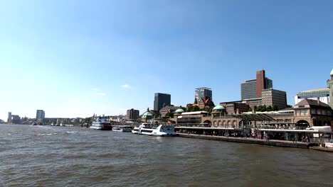 City-silhouette-of-Hamburg,-elbe-and-cityscape,-boats-and-ferries,-4K