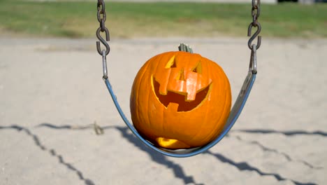 Happy-Halloween-pumpkin-on-the-swing-in-4K-Slow-motion-60fps