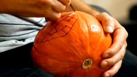 carving-a-Halloween-pumpkin-with-a-knife