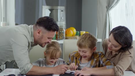 Parents-Drawing-Halloween-Decorations-with-Son-and-Daughter