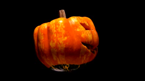 horrible-and-terrible-burning-pumpkin-with-cut-out-eyes