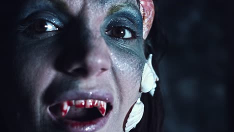 4k-Halloween-Shot-of-a-Horror-Woman-Mermaid-Showing-Bloody-Vampire-Teeth