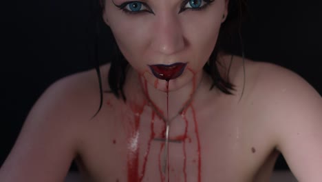 4k-shoot-of-a-horror-Halloween-model---Vampire-bleeding-and-grimacing-close-up