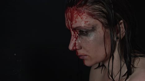 4k-shoot-of-a-horror-Halloween-model---Sad-girl-bleeding---side-shoot