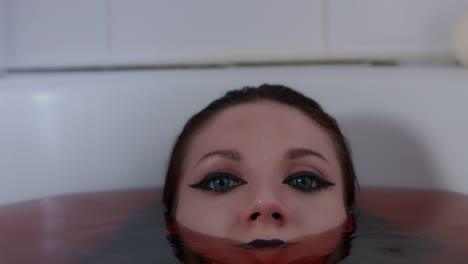 4k-shoot-of-a-horror-Halloween-model---Vampire-diving-in-bloody-water